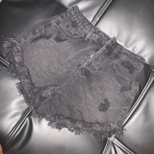 Black & slightly distress shorts in a size 00.